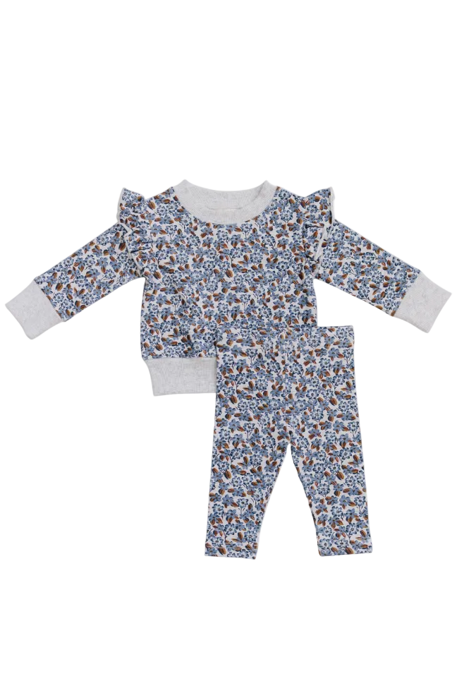 A cozy two-piece set featuring a floral print long sleeve top with ruffle details and matching leggings. Made from soft, breathable cotton, perfect for kids everyday activities.