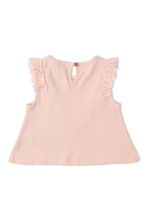 A soft blush ruffle top featuring delicate eyelet trim on the sleeves and a button closure at the back. This organic cotton piece is perfect for stylish, comfortable wear.