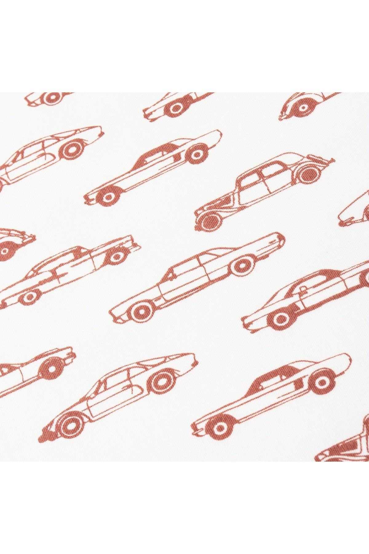A close-up of fabric featuring a playful cars print in earthy tones on a white background. This organic cotton material is ideal for childrens clothing, promoting comfort and sustainability.