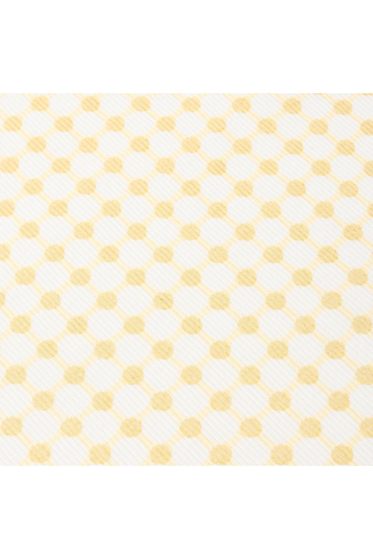 Close-up of a fabric featuring a yellow dotty gingham pattern on a white background, showcasing a soft, textured surface ideal for childrens clothing or accessories.