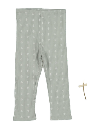 Light green cotton leggings with a subtle anchor print, made from soft, stretchy fabric. Accompanied by a decorative wooden toy, highlighting the playful and eco-friendly design for babies and toddlers.