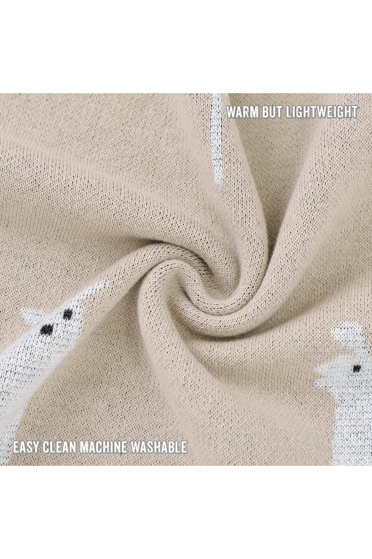 Beige knit blanket with white llama pattern, twisted to display texture. Text reads Warm but lightweight, easy clean machine washable.