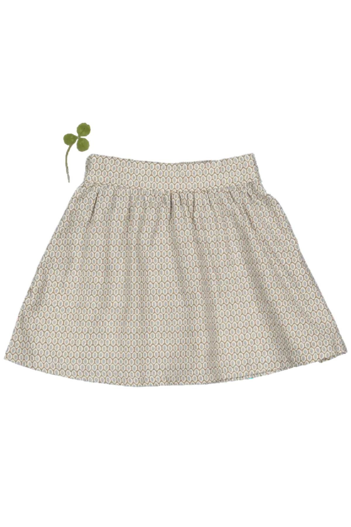 A light beige cotton skirt features a delicate leaf print and a green decorative bow. This dressy skirt is perfect for toddlers and kids, adding elegance to any outfit.