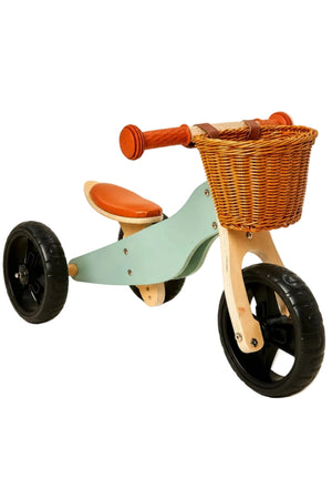A lightweight, 2-in-1 mini wooden balance bike features a teal frame, orange seat, and a woven basket.