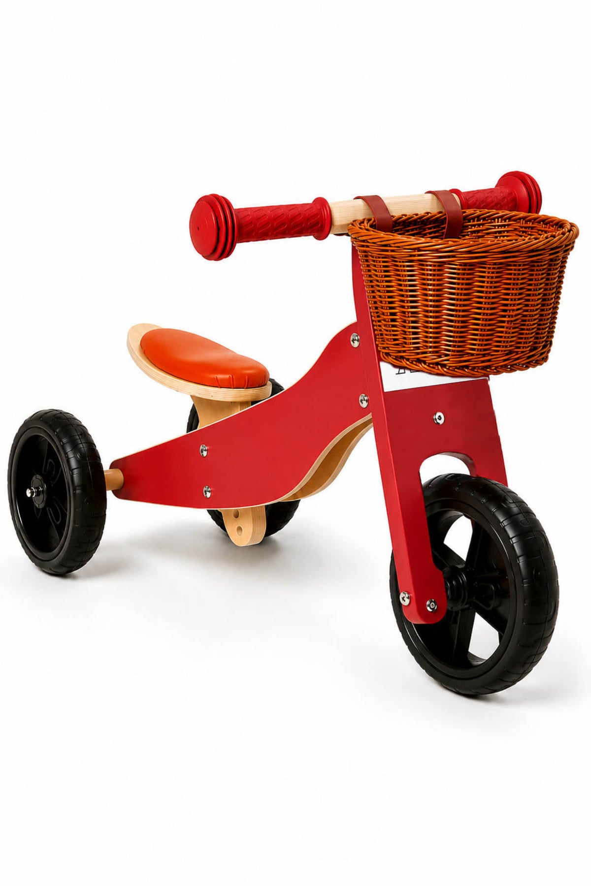 A colorful wooden balance bike features a red frame, black wheels, and an orange seat.