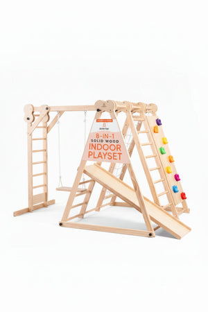 Wooden 8-in-1 indoor playset with ladder, slide, swing, and colorful climbing holds, ideal for toddlers.