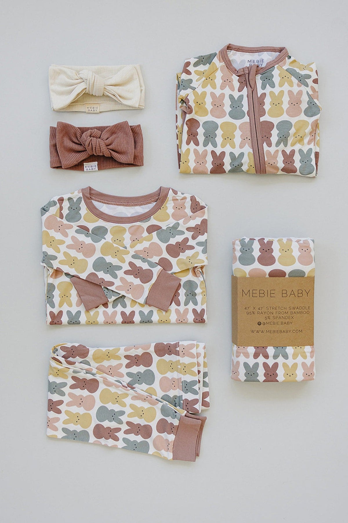 Mebie Baby pajama set with bunny print in pastel colors, bamboo fabric, includes headbands and a swaddle.