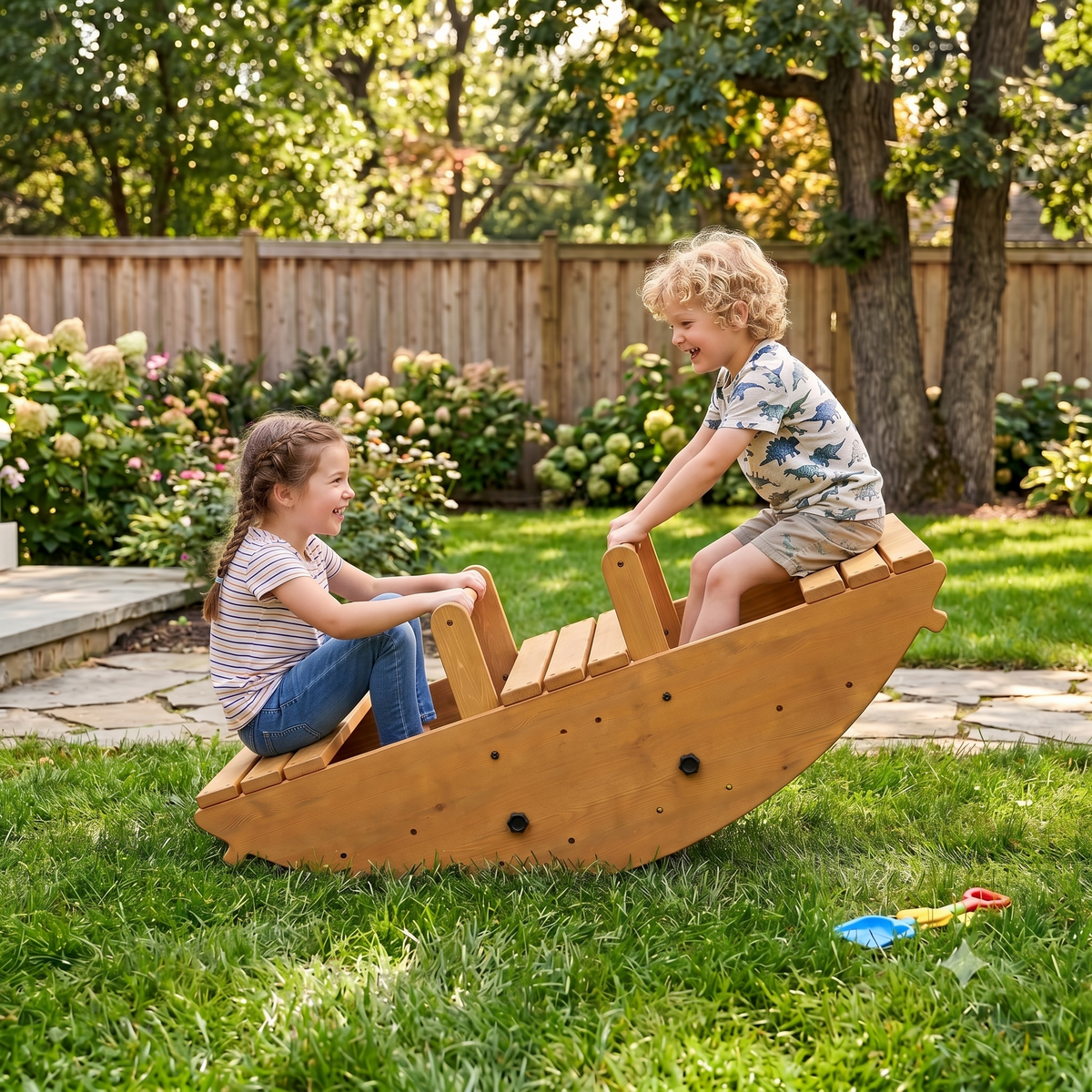 Two children joyfully rock on a wooden playset in a sunny garden, surrounded by lush greenery and blooming flowers, enjoying active outdoor play. The sturdy construction promotes safe, imaginative fun.
