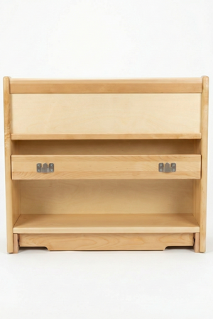 A light-colored wooden bookshelf features a simple, modern design with two open shelves and two drawers, ideal for organizing books and toys in a nursery or playroom setting.