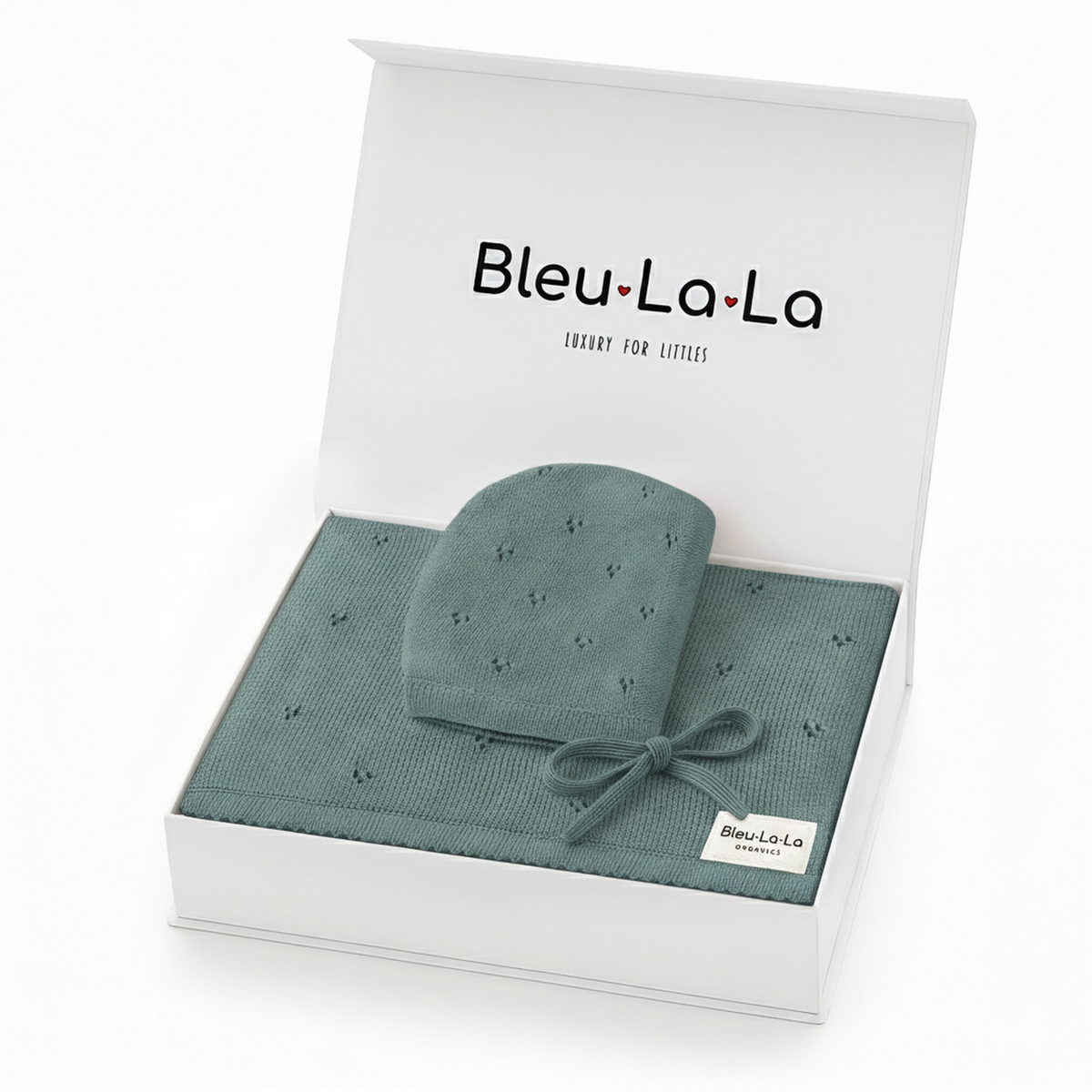 A beautifully packaged gift set from Bleu La La, featuring a soft, organic cotton pointelle blanket and a coordinating newborn hat in a calming teal color.
