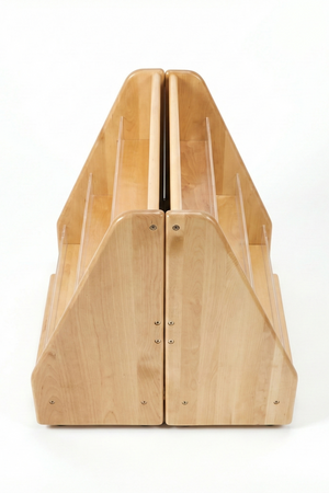 A double-sided wooden bookshelf features three tiers of front-facing display shelves, crafted from sustainable materials. Its natural finish and sturdy design make it ideal for childrens reading spaces.