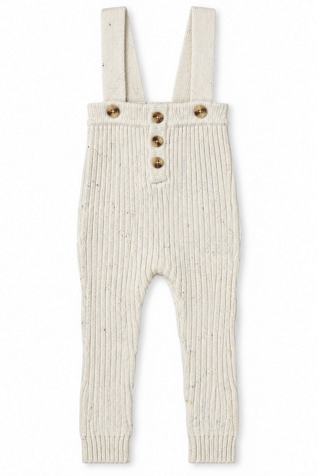Cream-colored knit cotton overalls feature ribbed texture, adjustable straps, and wooden buttons. Designed for babies and toddlers, these soft and sustainable overalls provide comfort and style for everyday wear.
