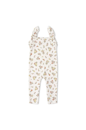 A soft organic cotton romper featuring delicate flutter sleeves and a floral print in pastel colors. Designed for comfort, this one-piece is perfect for babies on sunny days.