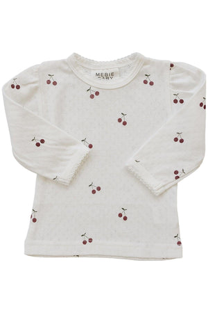 Cream long sleeve t-shirt featuring a cherry print and delicate pointelle texture, made from 100% cotton. Ideal for babies.