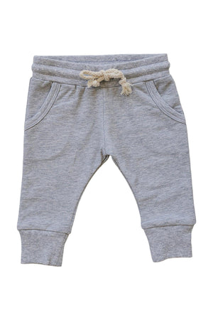 Light grey cotton joggers feature a comfortable elastic waistband with a functional drawstring and two front pockets. These joggers are perfect for babies, toddlers, and kids on the go.