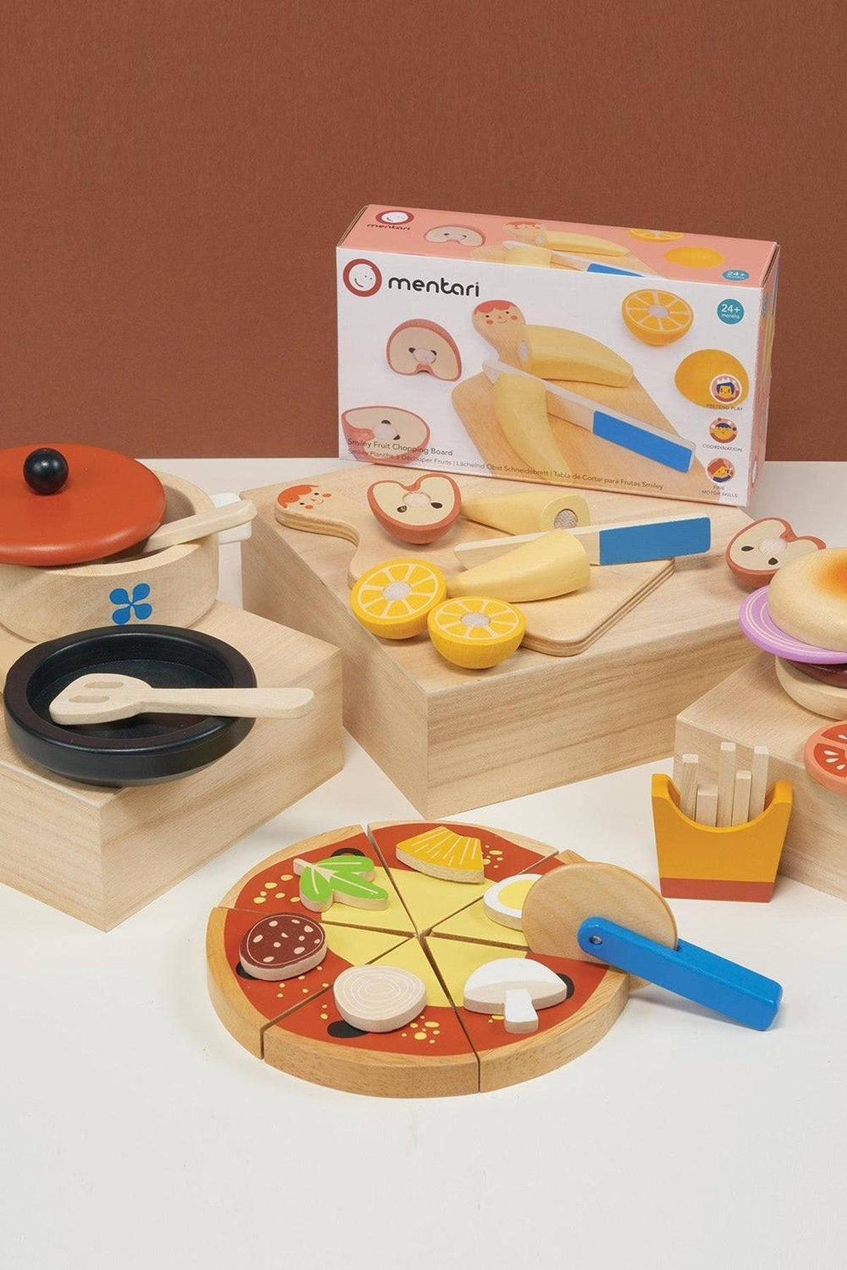 Mentari wooden toy set featuring a pizza, burger, and fruit, designed for imaginative play. Sustainable, eco-friendly materials.