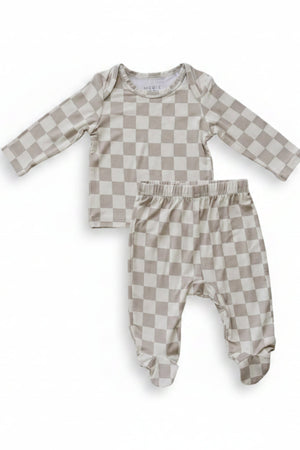 A taupe checkered bamboo layette set featuring a long-sleeve top and matching pants, designed for infants. The ultra-soft fabric ensures comfort and breathability for delicate skin.