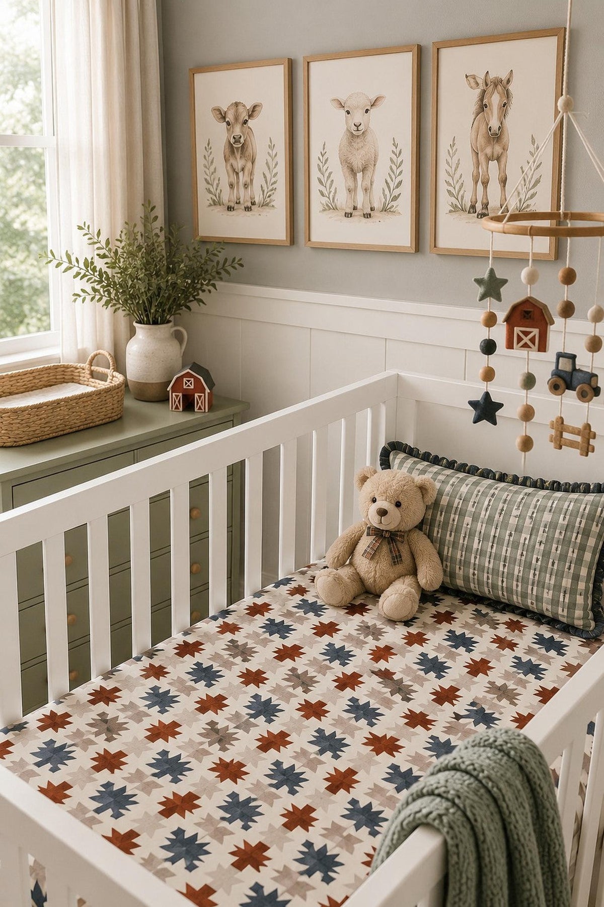 A cozy nursery features a crib with a Western Aztec muslin crib sheet displaying colorful geometric patterns.