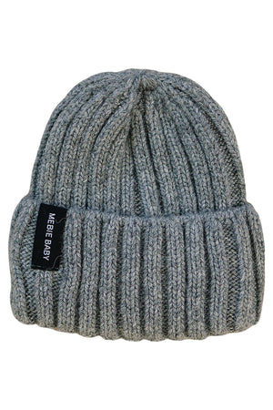 A soft, grey chunky knit beanie with a folded brim and a Mebie Baby tag, made from 100% angora wool.