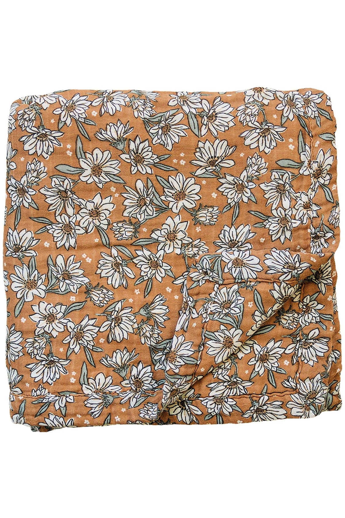 Brown muslin quilt featuring a white magnolia floral print, folded neatly. Made from 100% cotton fabric.
