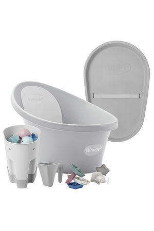 The image shows a gray Shnuggle baby bath set with accessories, including a tub, jug, and bath toys.