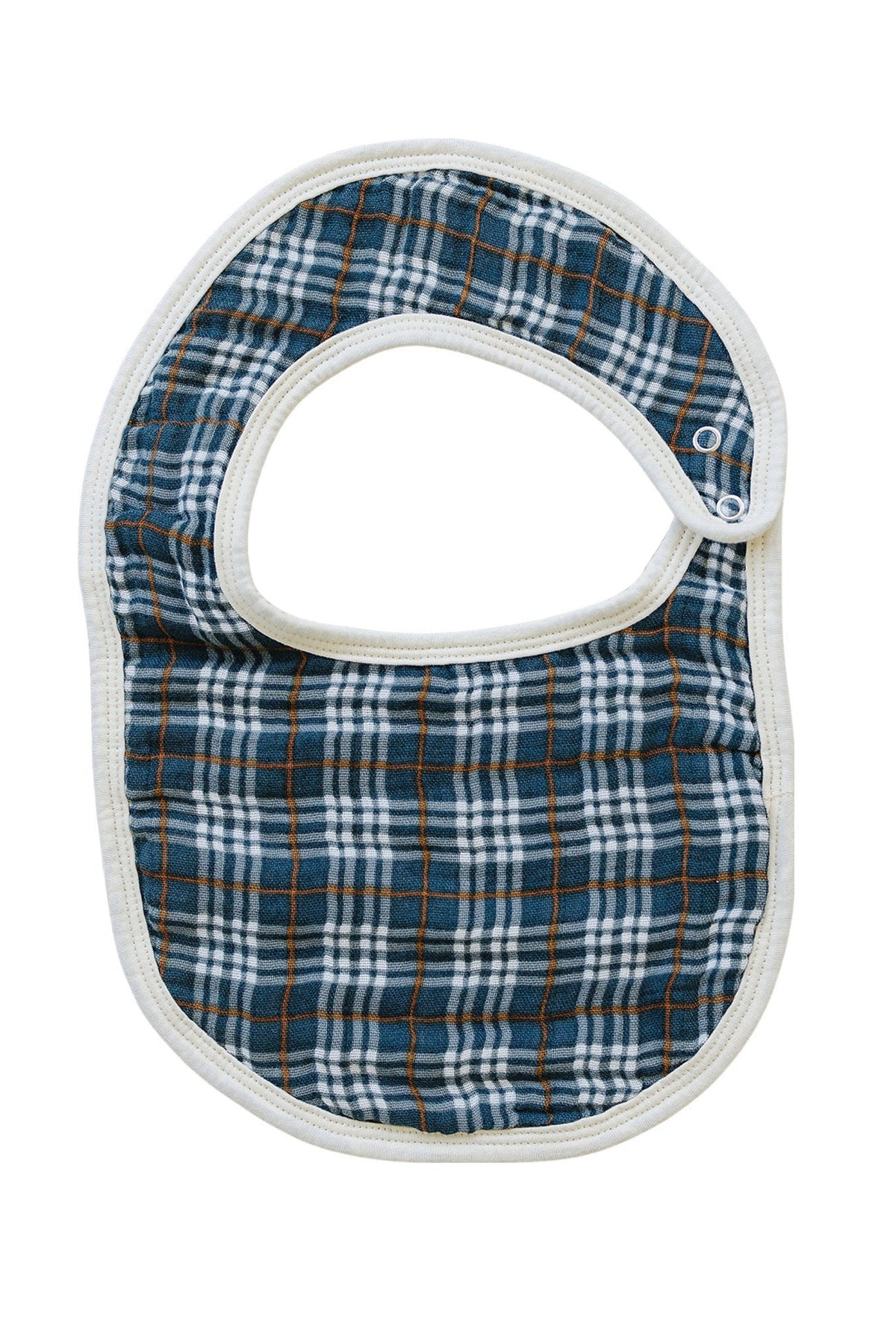 Navy plaid muslin bib with white edges and snap closure, made from soft, absorbent cotton fabric.