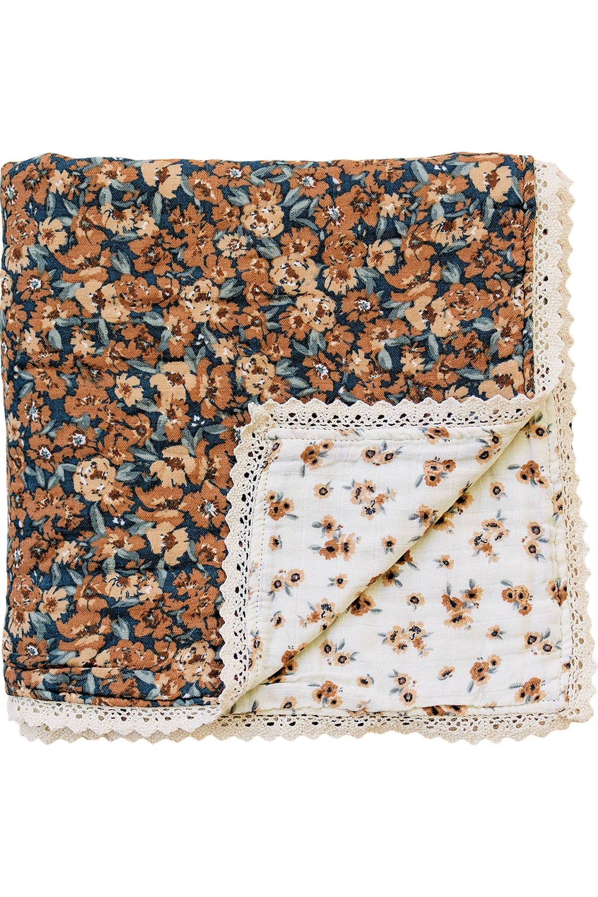 A folded floral muslin quilt with lace edges, featuring orange and blue flowers on a dark background.