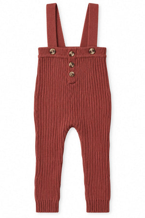Soft ribbed knit overalls in a warm rosewood color, featuring adjustable straps and wooden buttons, ideal for babies and toddlers seeking comfort and style. Perfect for layering in cooler weather.