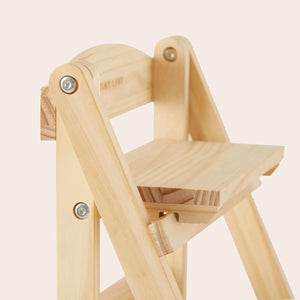 Natural wood play kitchen shelf featuring a sturdy design with a smooth finish. The light-colored wood complements a minimalist aesthetic, perfect for organizing children’s play food and accessories.