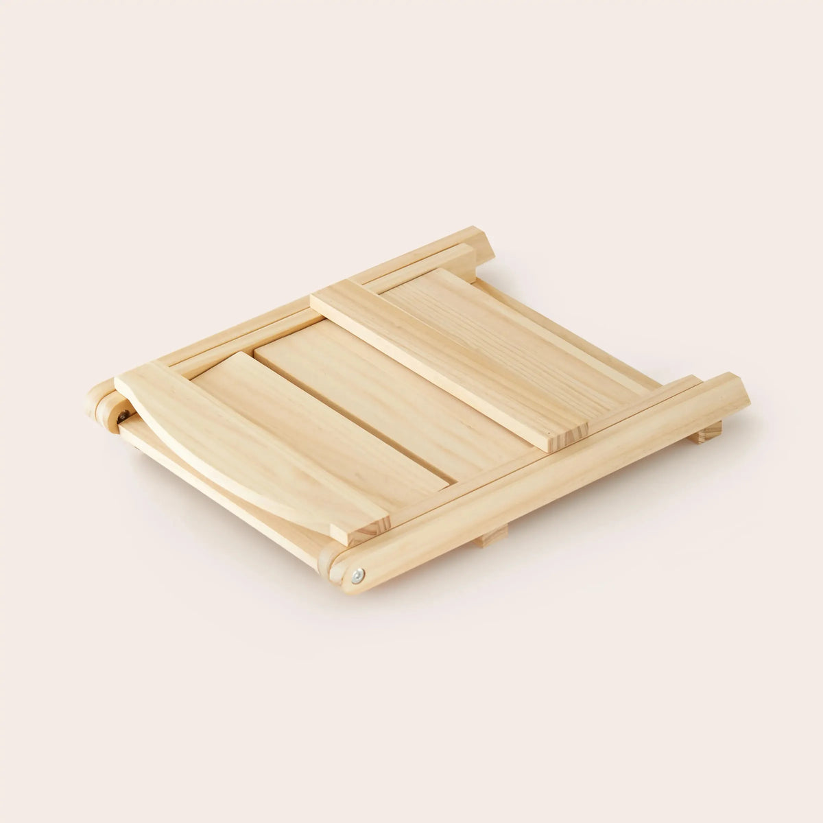 A light-colored wooden play food storage rack is shown, featuring a simple, functional design with sliding panels. The natural finish highlights the sustainable material, ideal for organizing childrens toys.