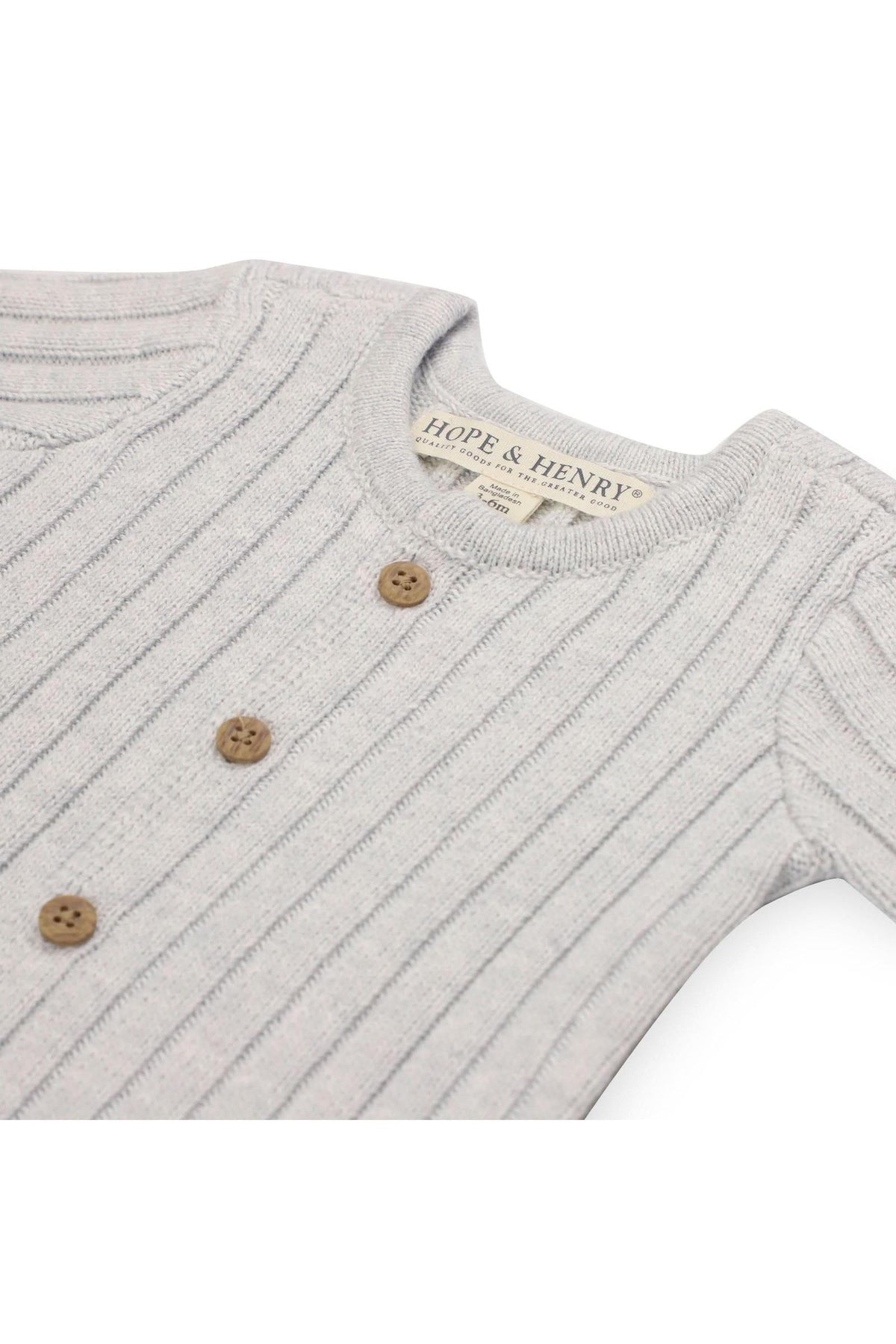 Light grey organic cotton romper with textured rib knit design, featuring a button-front closure and three wooden buttons. The romper from Hope & Henry is designed for newborns.
