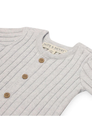 Light grey organic cotton romper with textured rib knit design, featuring a button-front closure and three wooden buttons. The romper from Hope & Henry is designed for newborns.