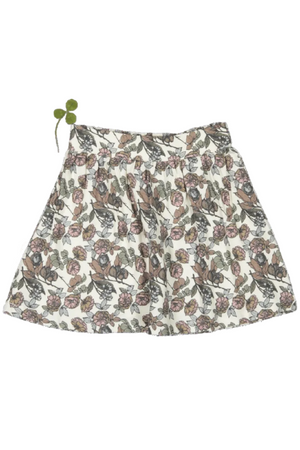 Floral cotton skirt featuring a playful design with soft, earthy tones and an elastic waistband. Ideal for toddlers and kids, this stylish piece adds charm to any outfit.