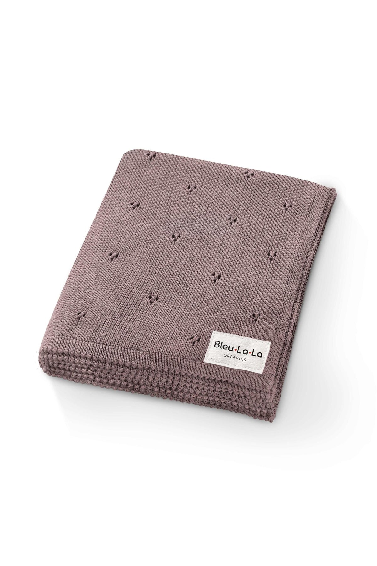 A folded, mauve pointelle knit blanket with a Bleu-La-La Organics label, crafted from organic cotton.