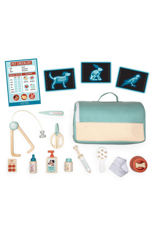 A soft carry case in mint green holds various wooden veterinary tools, including a stethoscope, syringe, and pet care items, alongside an animal x-ray checklist for imaginative play.