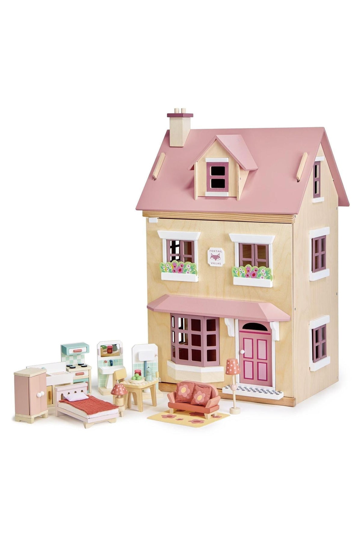 A charming wooden dollhouse with a pink roof, featuring detailed interior furniture, crafted from sustainable materials for imaginative play.