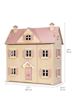 Wooden dollhouse with pink roof and measurements on a white background