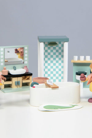 A wooden dollhouse bathroom set featuring a bathtub, sink, shower unit, and accessories, designed for children aged 3 and up.
