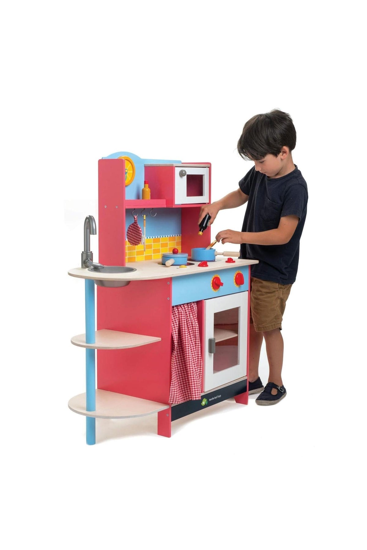 A child plays with a colorful wooden kitchen set featuring a stove, sink, and shelves, promoting imaginative cooking adventures.