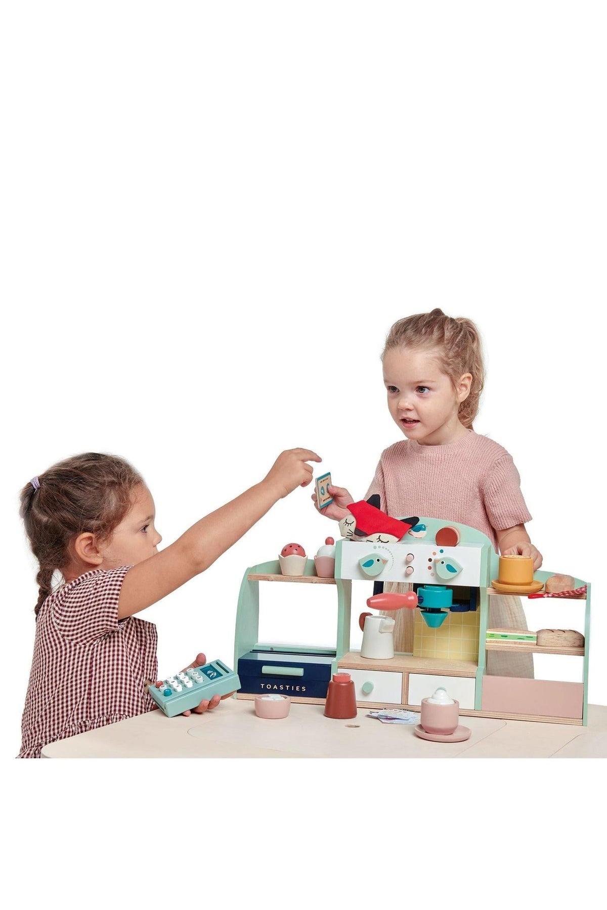 Two children play with the Tender Leaf Wooden Toys Bird’s Nest Café, featuring colorful wooden accessories and a coffee shop.