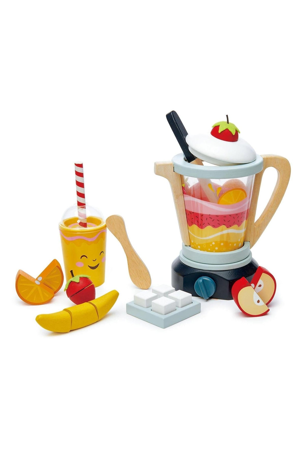 A colorful wooden blender set features a smiling take-away cup, assorted fruit pieces, a wooden knife, and a spoon.