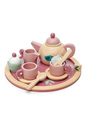 A wooden tea set by Tender Leaf featuring a pink teapot, cups, and a cupcake on a round tray with a bird motif, designed for children aged 3 years and.