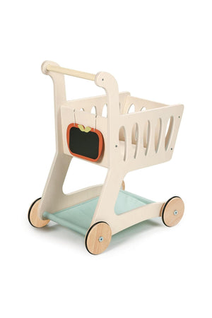 A light wooden shopping cart features a fabric base and an apple-shaped chalkboard for notes, ideal for imaginative play.