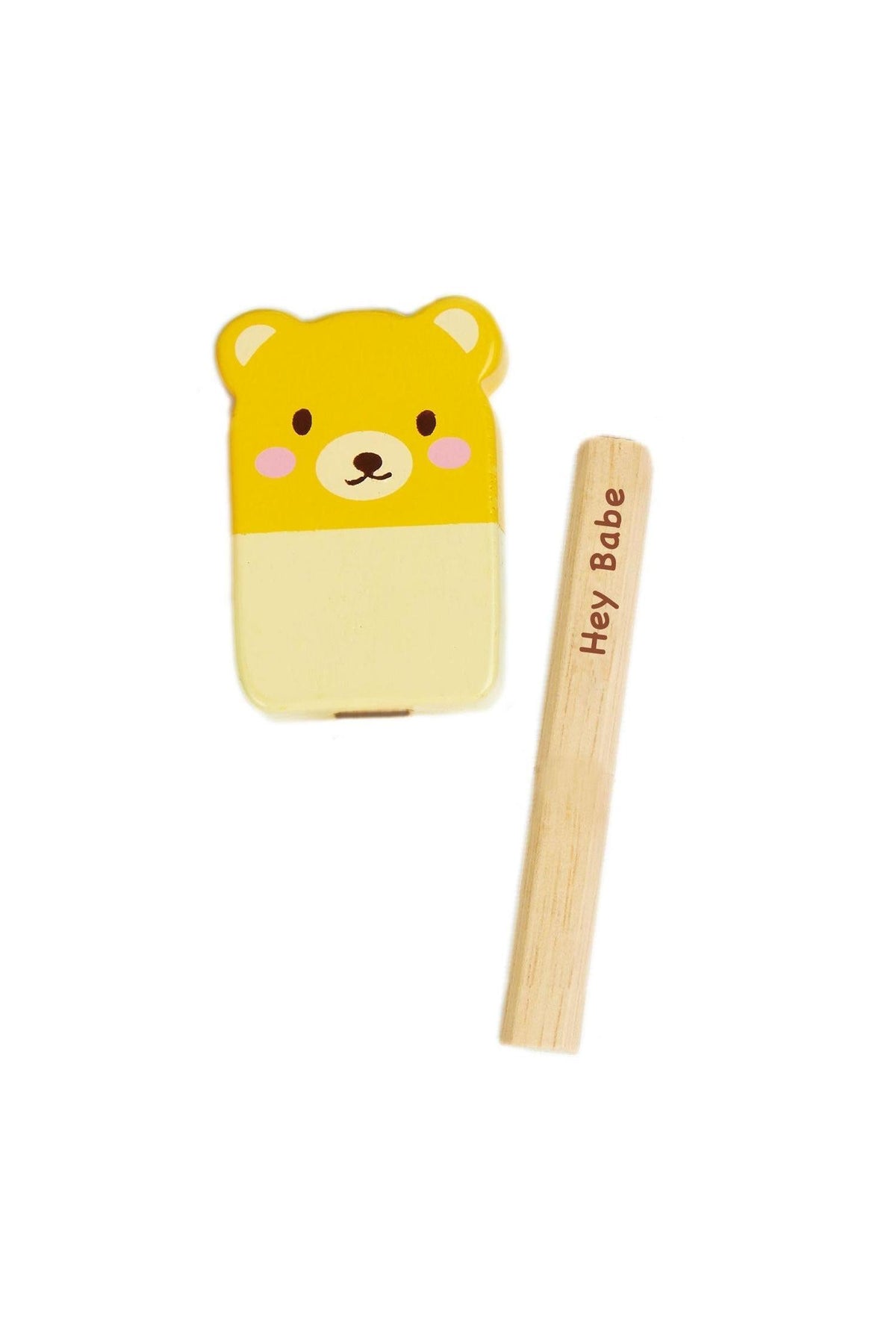 A cute yellow bear-shaped ice pop toy made of wood, accompanied by a removable wooden stick with Hey Babe printed.