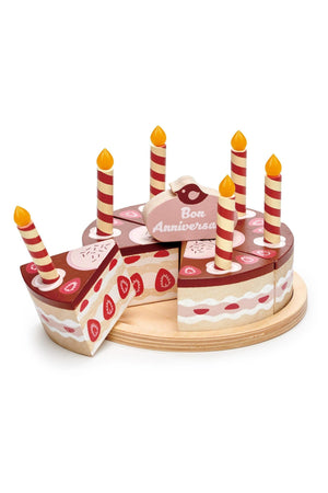 Colorful wooden birthday cake set with removable slices and lit candles, designed by Tender Leaf Toys for imaginative play.