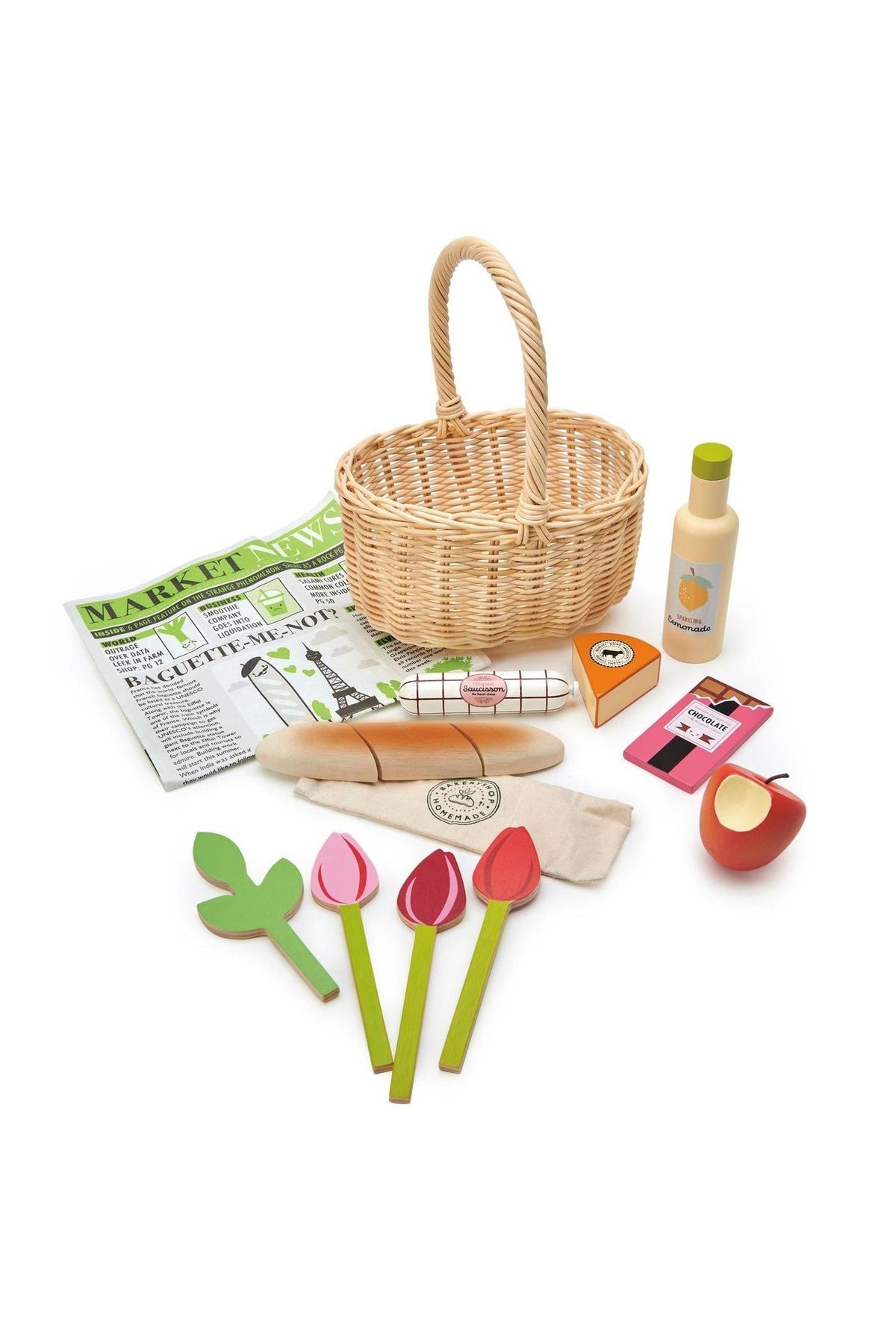 A wicker shopping basket filled with colorful wooden food items, flowers, a newspaper, and a bottle, all designed for imaginative.