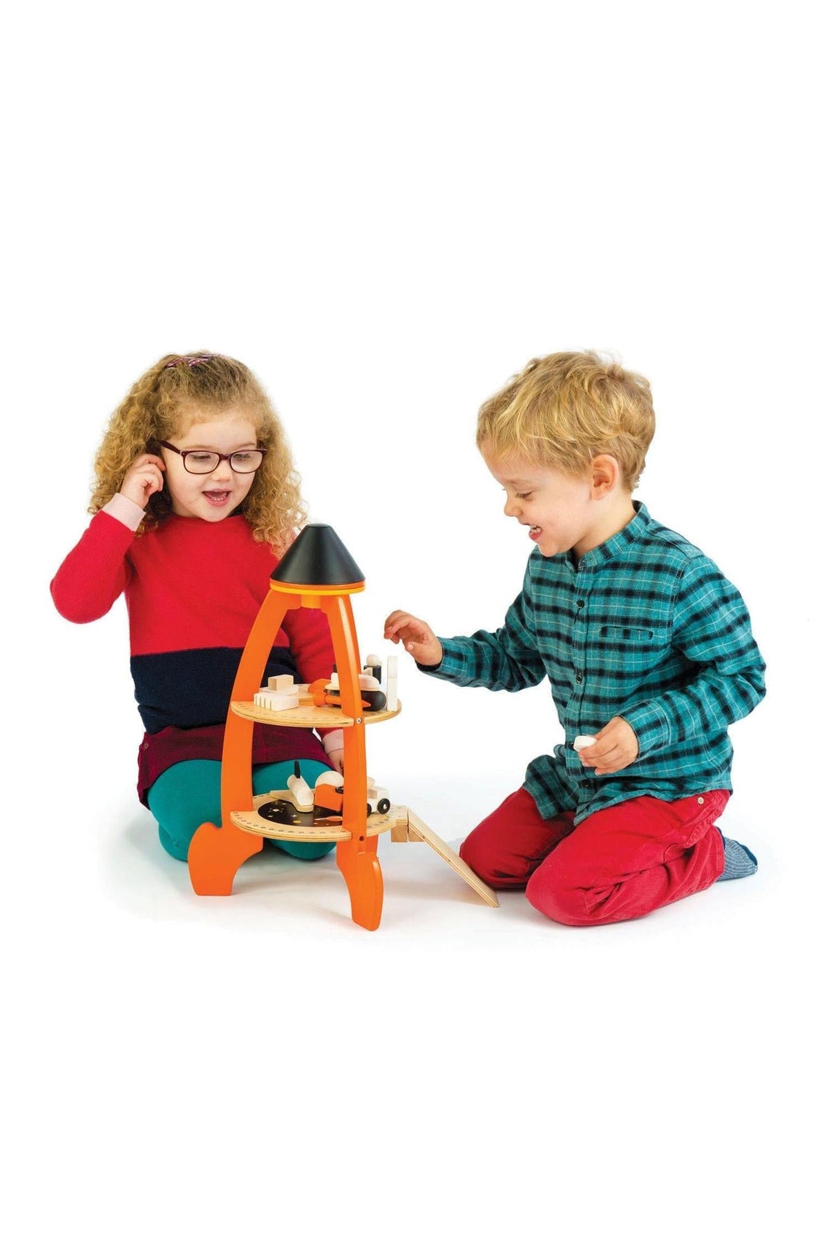 Two children play with a colorful wooden rocket toy, engaging in imaginative role play on a white background.