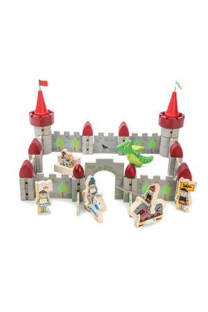 Colorful wooden Dragon Castle playset features red and blue soldiers, a baby dragon, and castle walls with flags.