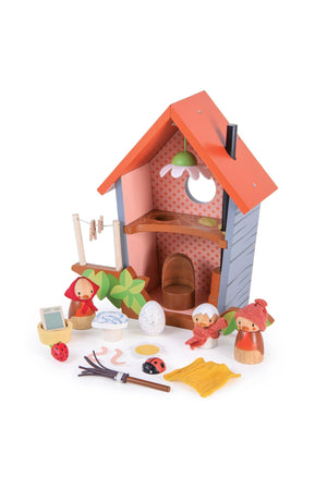 Wooden toy birdhouse set with red roof, featuring bird figures, eggs, and small accessories for imaginative play.
