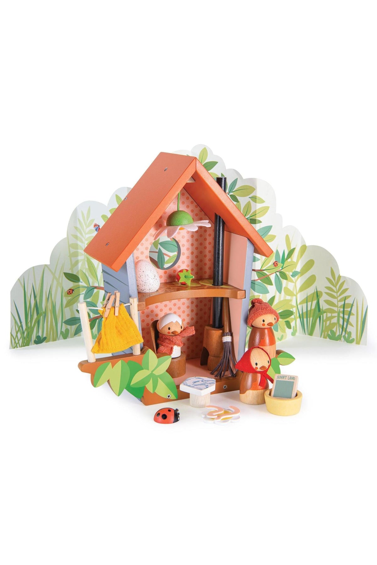 Colorful wooden playhouse with bird figures, leaf decorations, and a backdrop of greenery. Sustainable, family-friendly toy set.